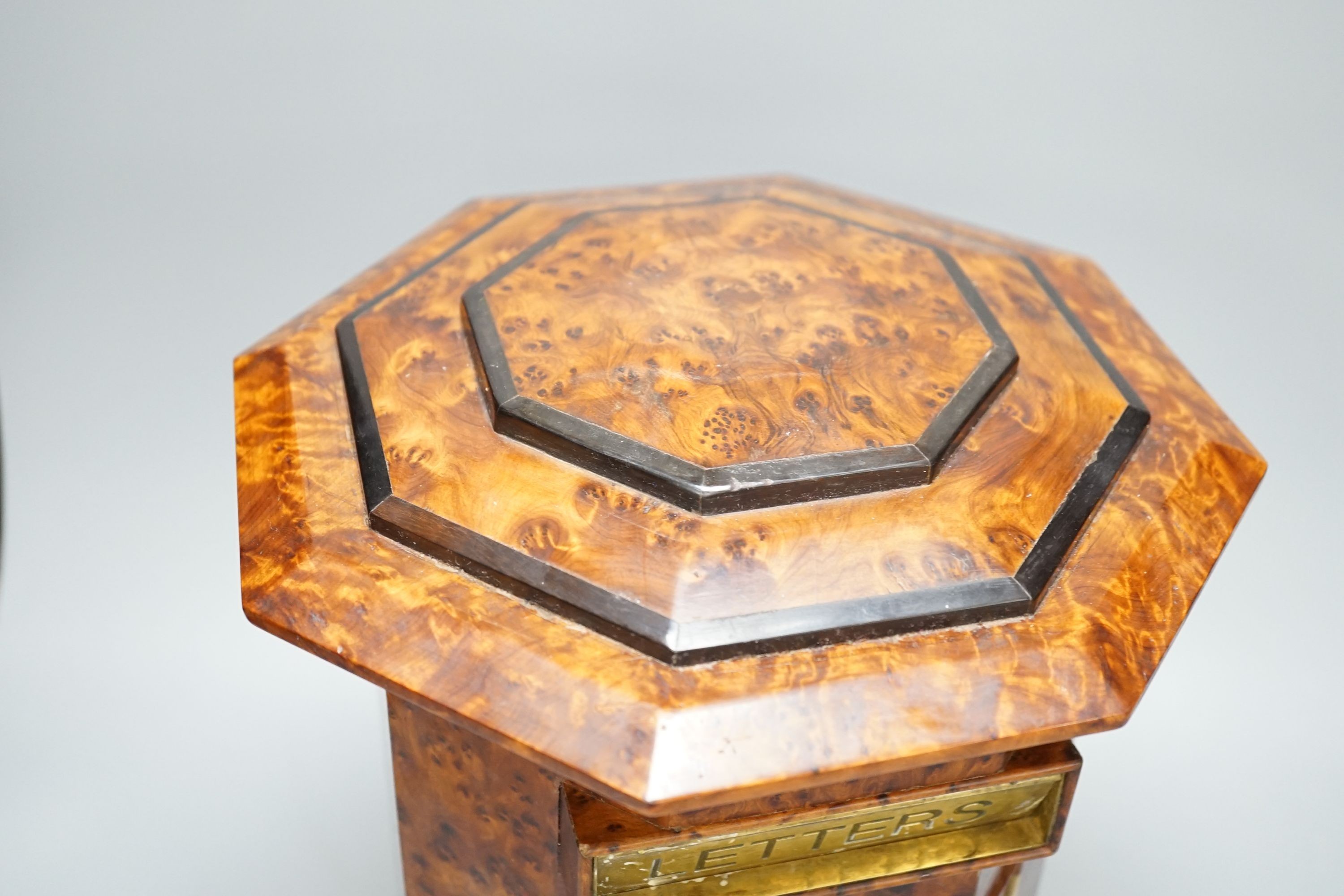 A Victorian-style amboyna octagonal country house post box, 34 cms high.